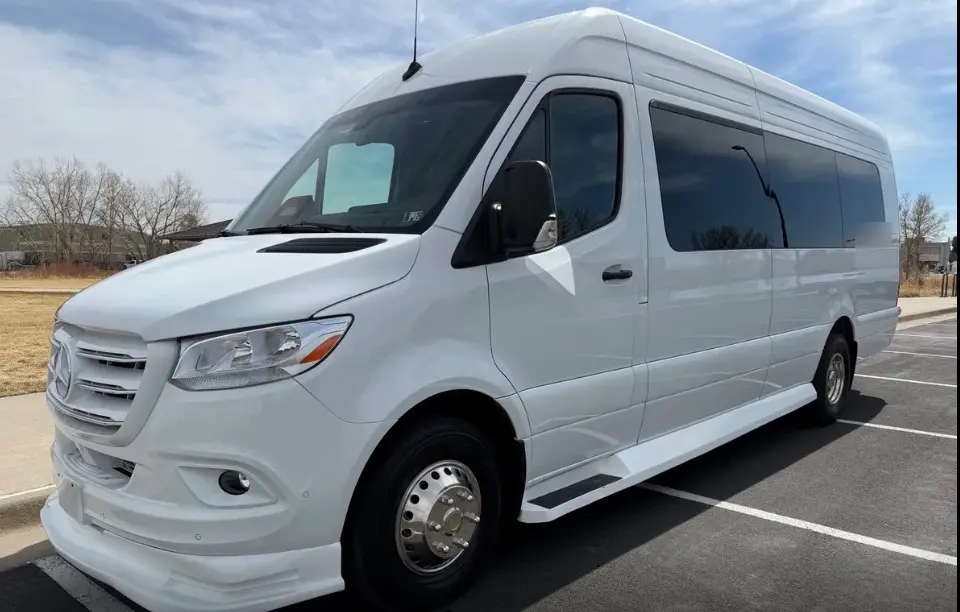 Monument 16 passenger white Sprinter limo bus