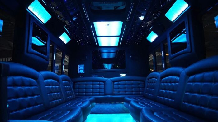 Wraparound seating and blue LED lights – Monument party bus rental